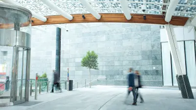 two people walking through hall