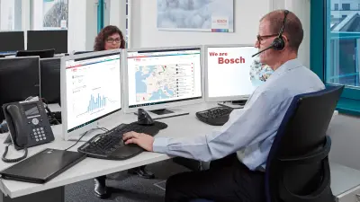 Associates at the Monitoring Center busy at their workstation screens